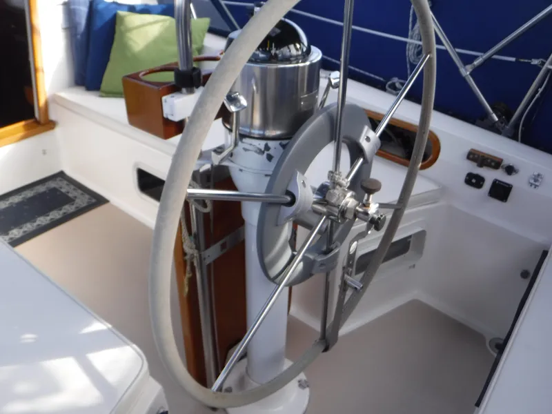 Steering wheel of a 1985 Catalina 36 MK1 sailboat cockpit.