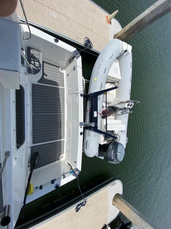 Newer high load electric dingy davit.