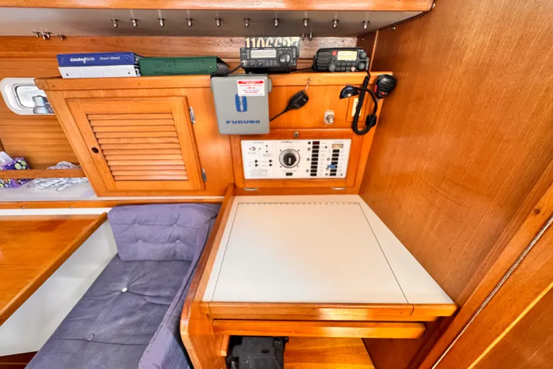 1995 Catalina 36 MkII yacht interior with navigation station and wooden cabinetry.
