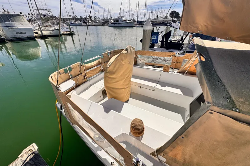 1995 Catalina 36 MkII sailboat docked in a marina, featuring a spacious cockpit.