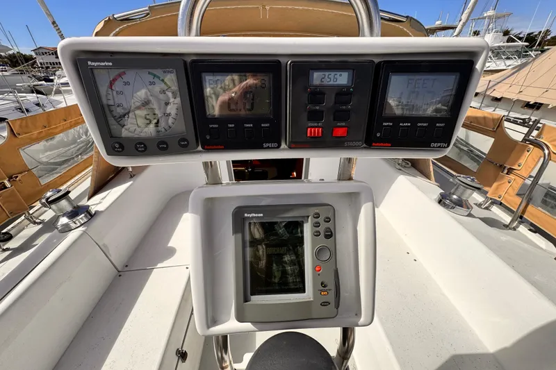 Cockpit instruments of a 1995 Catalina 36 MkII sailboat, featuring Raymarine displays.