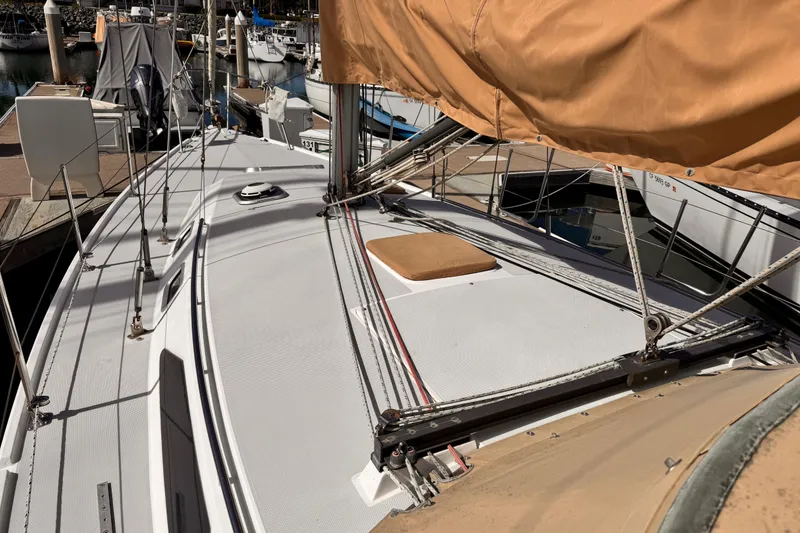 Sailboat deck of 1995 Catalina 36 MkII, docked at marina with covered sails.