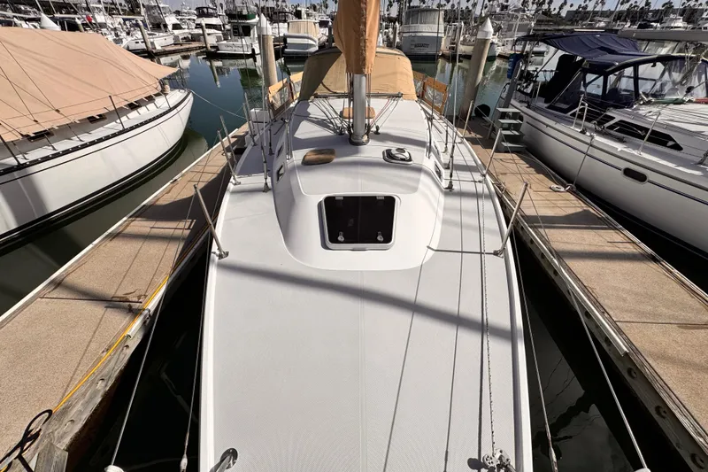1995 Catalina 36 MkII sailboat docked at marina, top deck view.