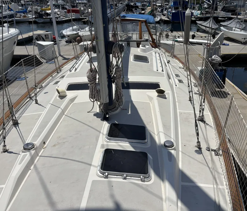 Deck view of 1982 Norseman 447 sailboat docked at a marina.