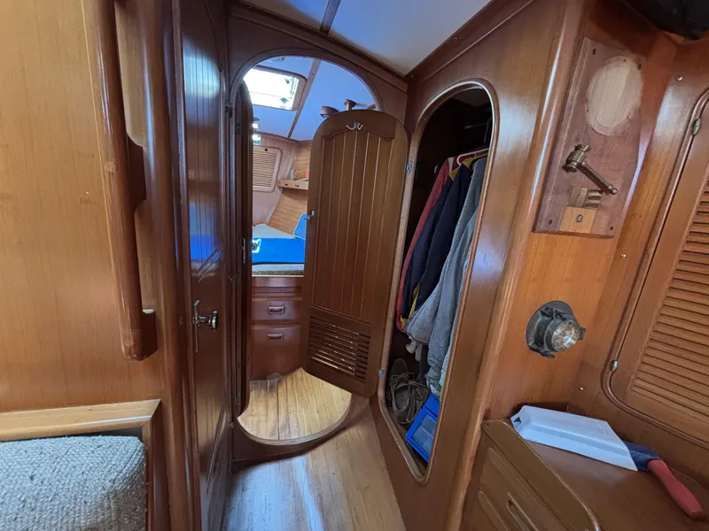 Interior of 1982 Norseman 447 sailboat with wooden cabinetry and cozy cabin space.