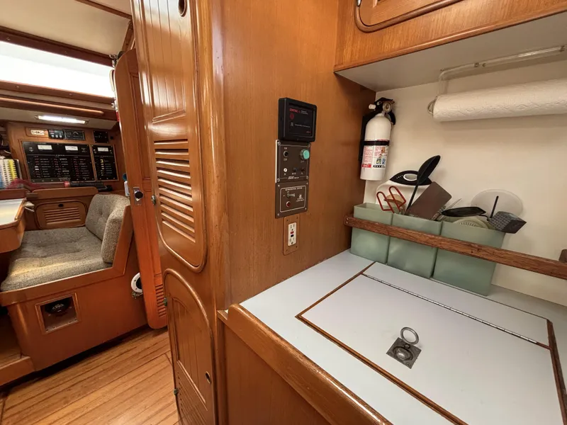 Interior of 1982 Norseman 447 yacht with wooden cabinetry and seating area.