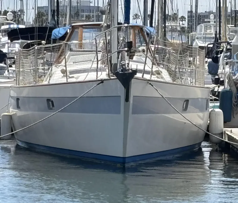 1982 Norseman 447 sailboat docked in a marina, front view.