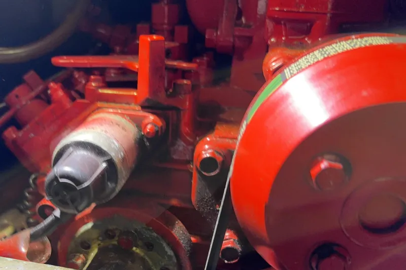 Close-up of a red Norseman 447 engine component, 1982 model.