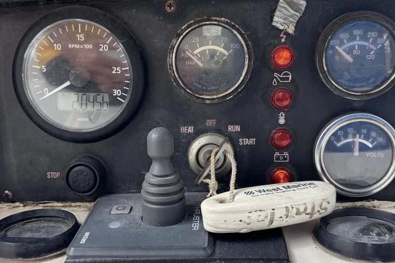 Control panel of a 1982 Norseman 447 boat with gauges and switches.