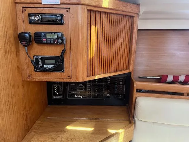 Control panel of a 2002 Catalina 350 sailboat with communication equipment.
