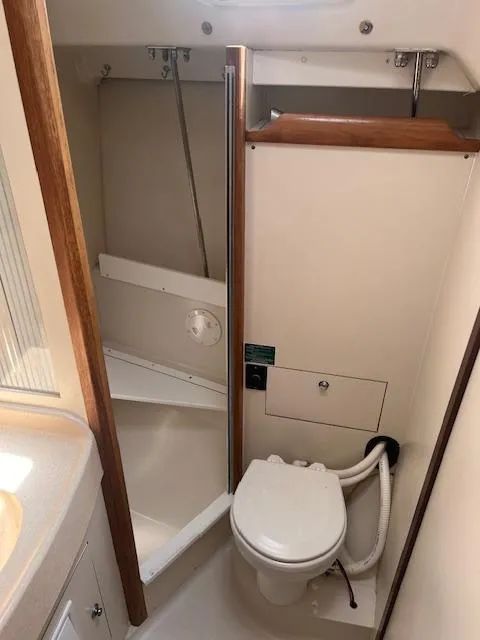 2002 Catalina 350 yacht bathroom with toilet and shower area.