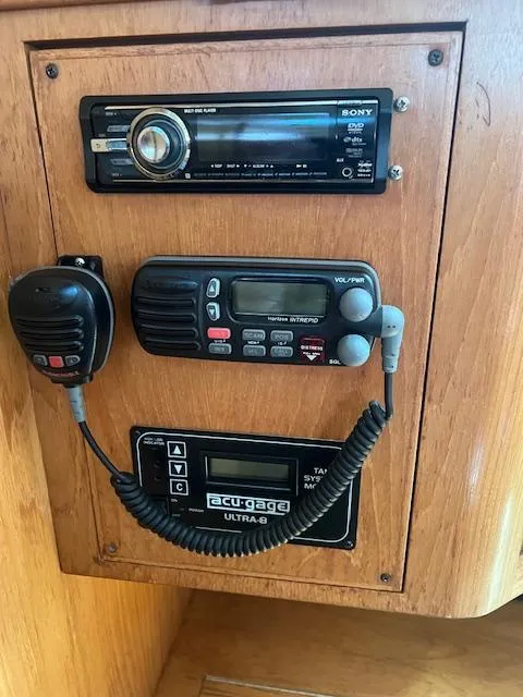 Control panel of a 2002 Catalina 350 sailboat with radio and navigation equipment.