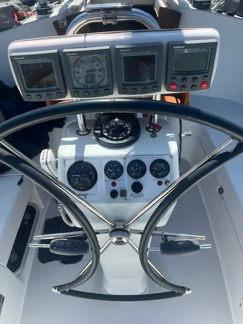 Steering wheel and instrument panel of a 2002 Catalina 350 sailboat.