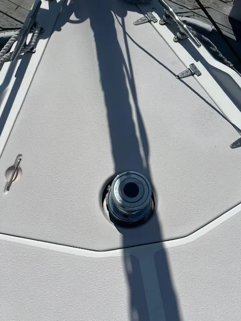 Deck of 2002 Catalina 350 sailboat with winch and cleat.