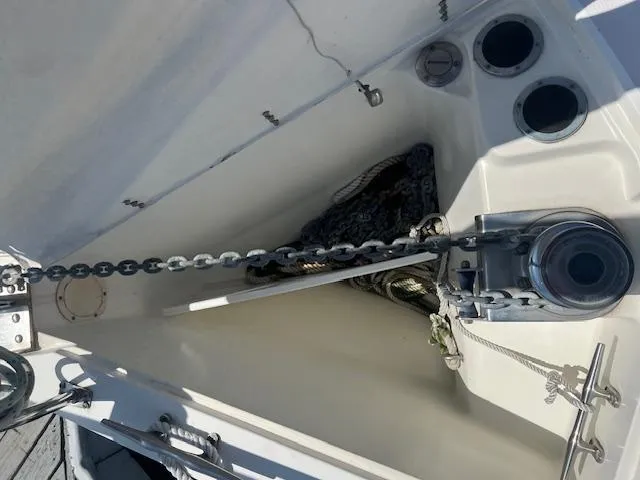 Anchor chain and winch on a 2002 Catalina 350 sailboat deck.