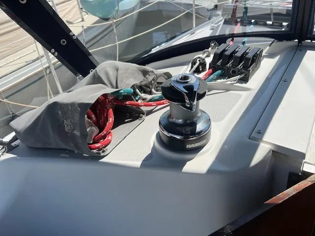 Deck of 2002 Catalina 350 sailboat with winch and ropes.