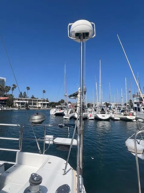 Catalina 350 sailboat docked in marina, clear blue sky, 2002 model.