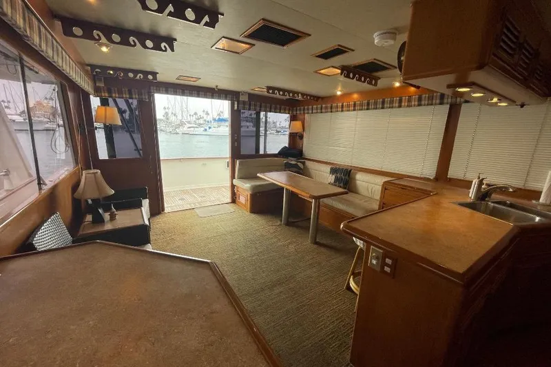 Luxurious interior of 1990 Offshore Yachts 55 Pilothouse with spacious seating and elegant decor.