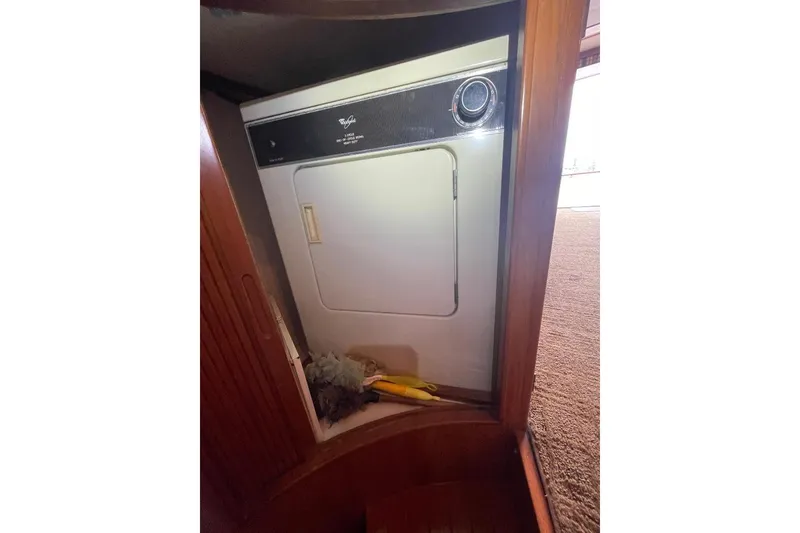 Laundry area with dryer inside 1990 Offshore Yachts 55 Pilothouse.