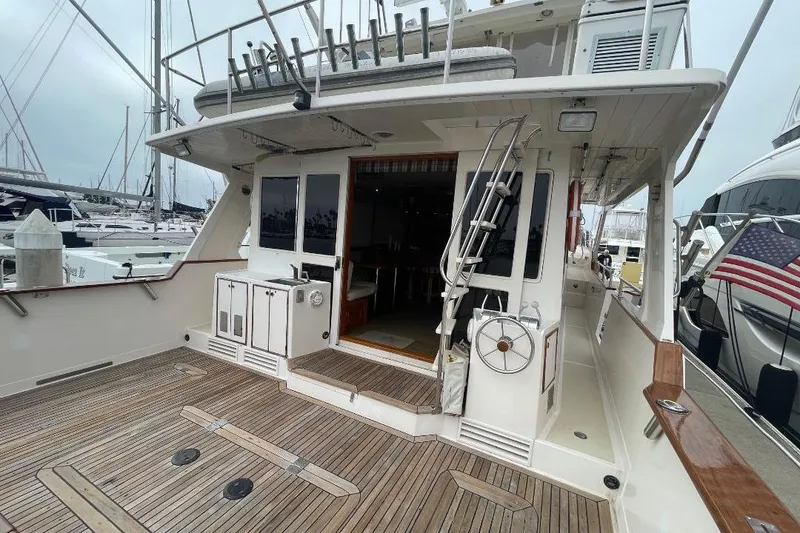 1990 Offshore Yachts 55 Pilothouse with spacious deck and marina view.