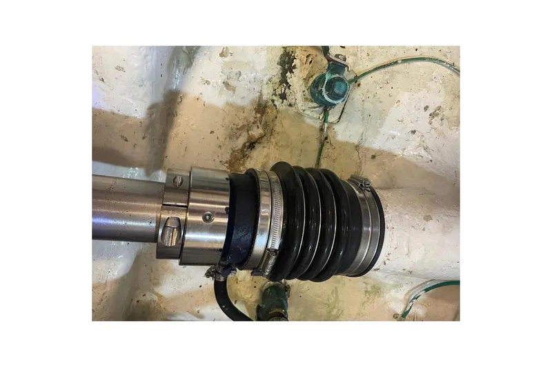 Close-up of a 1990 Offshore Yachts 55 Pilothouse shaft seal in the engine room.