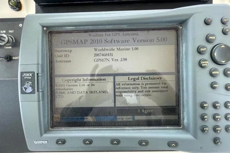 Garmin GPSMAP 2010C display on 1990 Offshore Yachts 55 Pilothouse, showing software version and legal disclaimer.