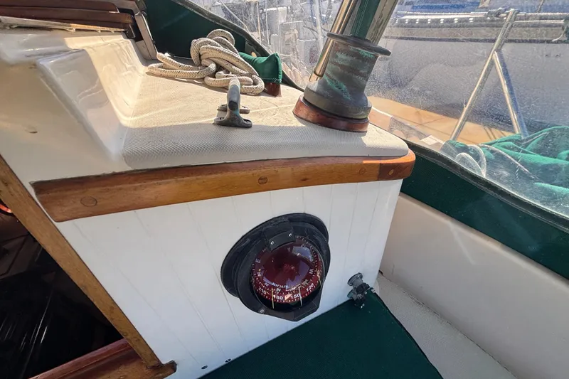 Interior of a 1983 Bristol Channel Cutter 28, featuring a compass and winch.