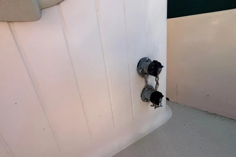 Fuel caps on a 1983 Bristol Channel Cutter 28 sailboat deck.