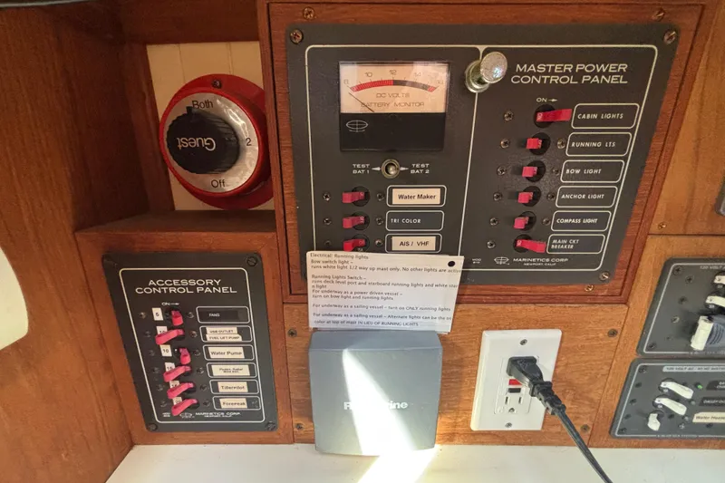 Control panels on a 1983 Bristol Channel Cutter 28, featuring switches and battery monitor.