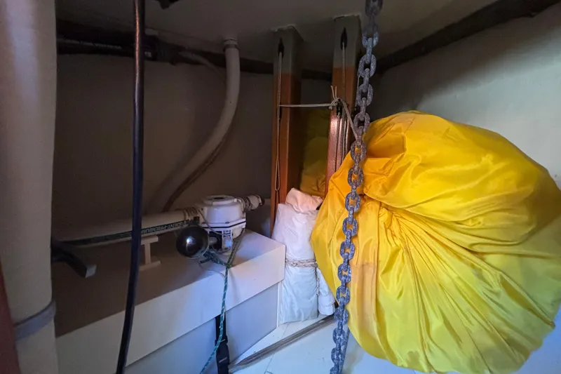 Interior of 1983 Bristol Channel Cutter 28 with yellow sail and equipment.