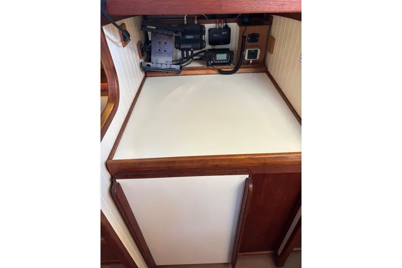 Navigation station of 1983 Bristol Channel Cutter 28 with communication equipment.