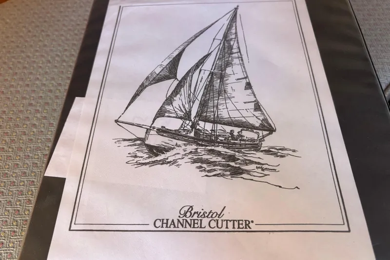 Illustration of a 1983 Bristol Channel Cutter 28 sailboat on water.