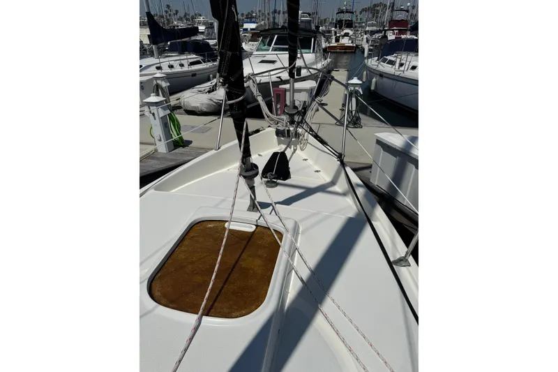 1989 Gulf Pilot House sailboat deck with rigging in marina setting.
