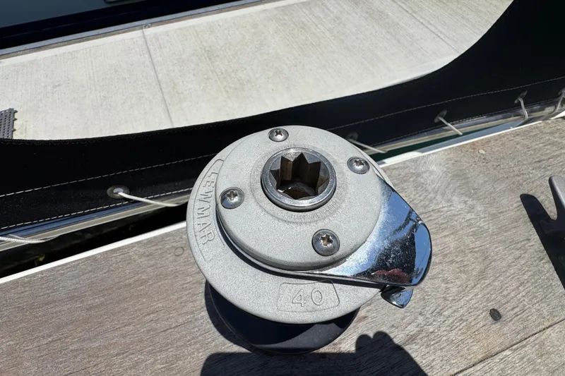 Lewmar winch on 1989 Gulf Pilot House boat deck in sunlight.