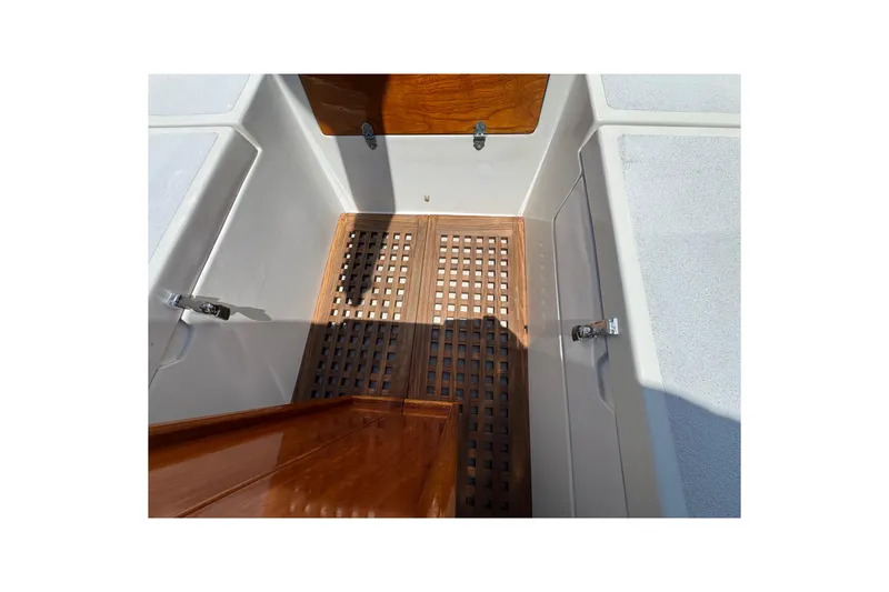 1989 Gulf Pilot House boat interior with wooden flooring and storage compartments.