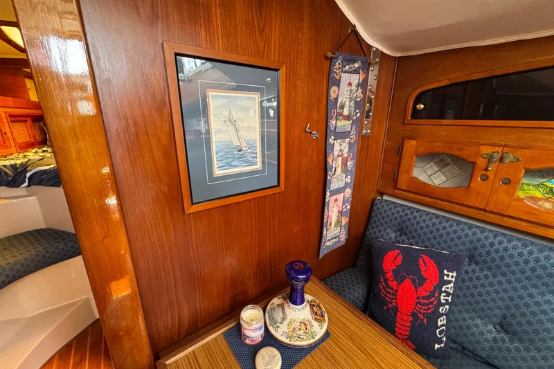 Interior of a 1989 Gulf Pilot House with nautical decor and wooden finishes.