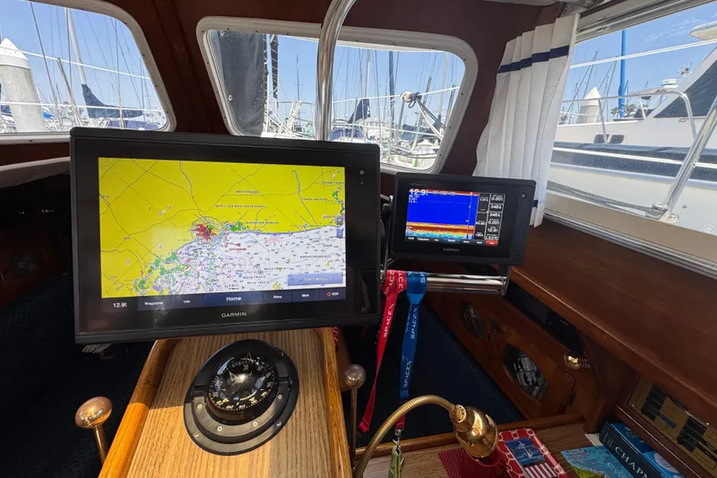 Interior of a 1989 Gulf Pilot House with navigation screens and compass.