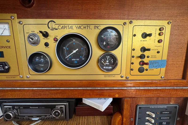 Control panel of a 1989 Gulf Pilot House yacht with gauges and switches.