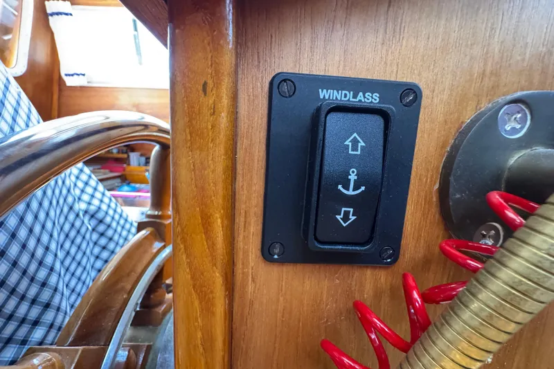 Windlass control switch on 1989 Gulf Pilot House boat dashboard.