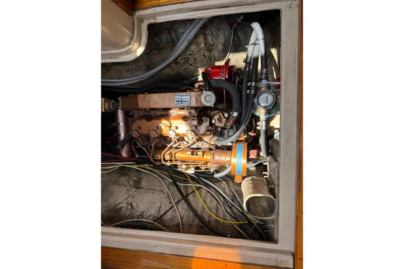 Engine compartment of a 1989 Gulf Pilot House boat, showing detailed mechanical components.