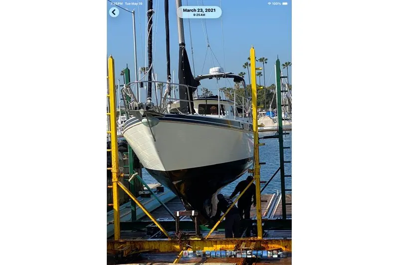 1989 Gulf Pilot House sailboat in dry dock for maintenance.