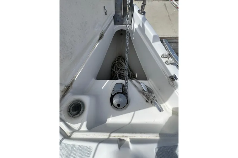 Anchor locker of 1999 Hunter Passage 420 sailboat with chain and rope.
