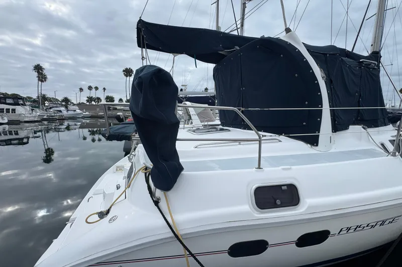 1999 Hunter Passage 420 sailboat docked in a marina with overcast skies.