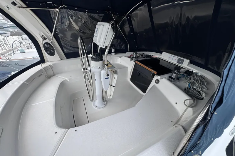 1999 Hunter Passage 420 yacht cockpit with steering wheel and navigation equipment.
