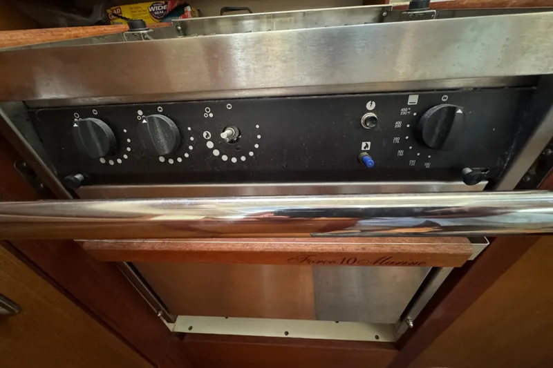 Oven controls on 1999 Hunter Passage 420 yacht, featuring Force 10 Marine branding.
