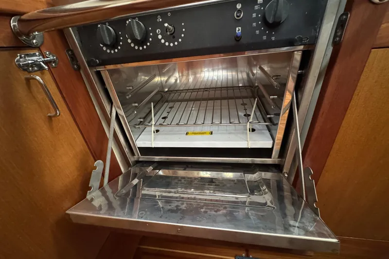 Stainless steel oven inside a 1999 Hunter Passage 420 yacht kitchen.