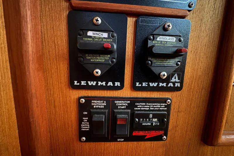 Control panel on a 1999 Hunter Passage 420 sailboat with Lewmar switches.