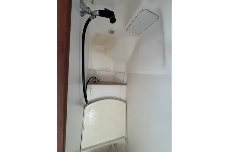 Shower area in 1999 Hunter Passage 420 sailboat, featuring a handheld showerhead.