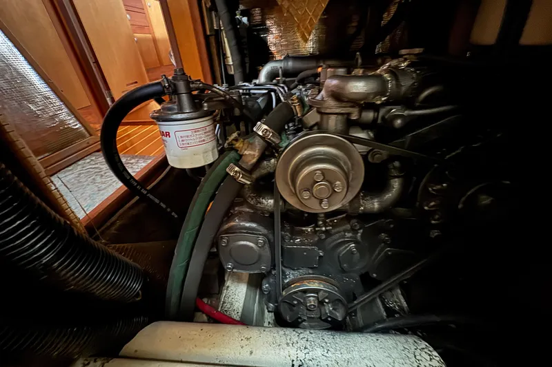 Engine compartment of a 1999 Hunter Passage 420 sailboat, showcasing mechanical components.