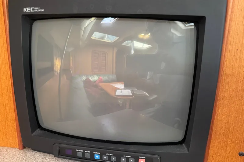 Reflection on vintage TV screen inside 1999 Hunter Passage 420 yacht cabin.